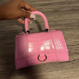 Mini pink purse with handle and attachable strap